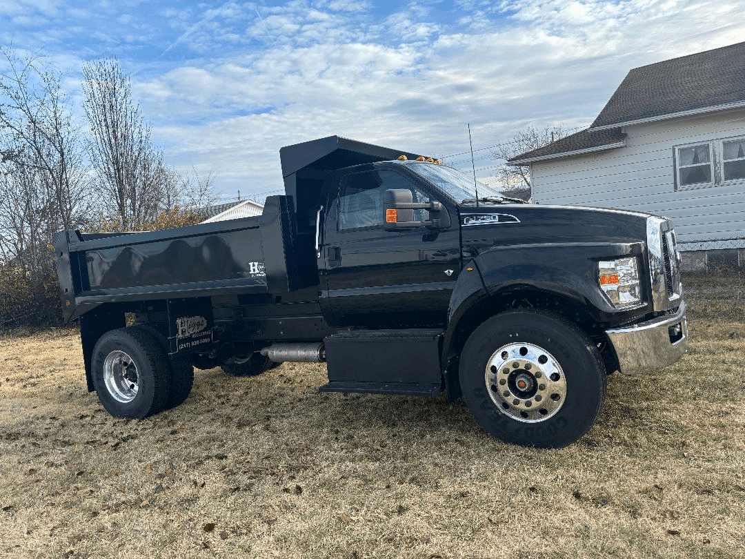 Hammer head rental dump truck image